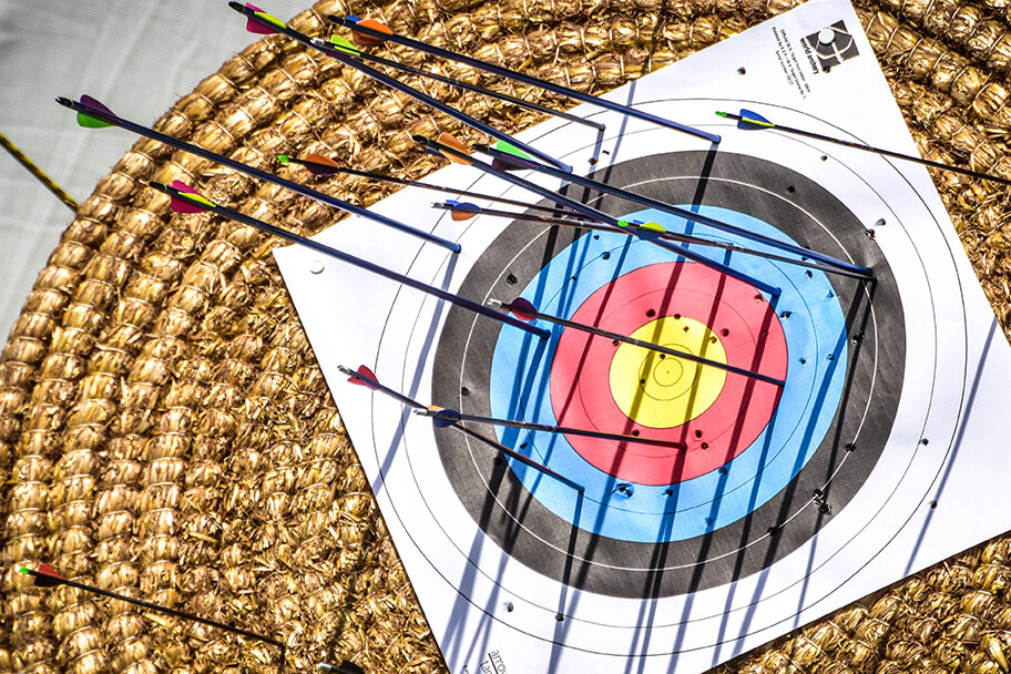 Archery board with arrows