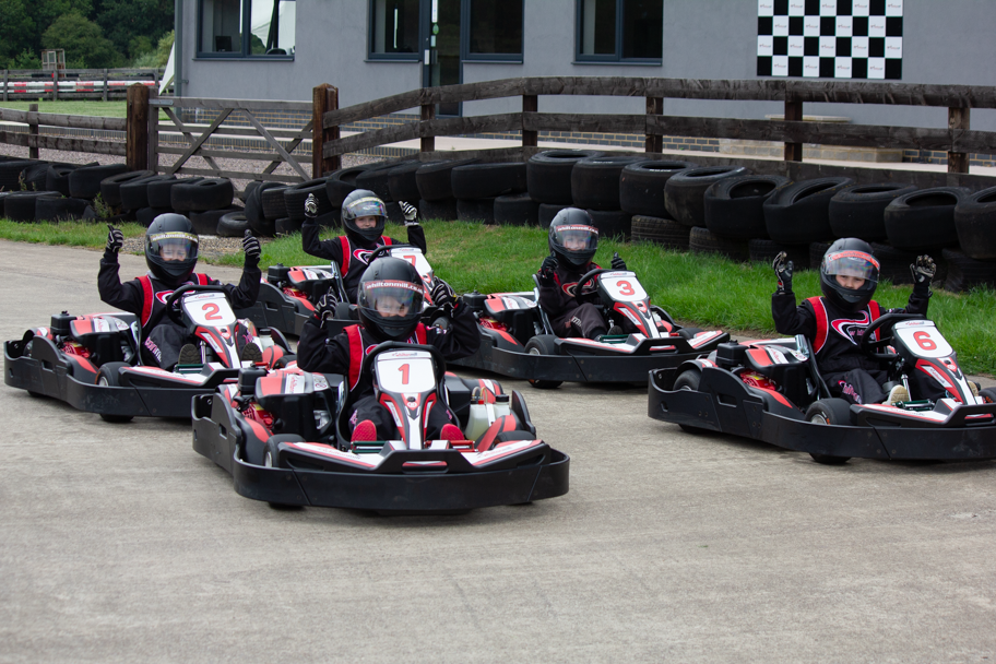 kids ready to race and lined up in go-karts
